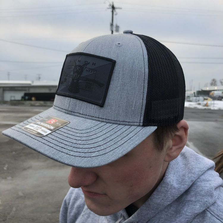 Richardson Heather Grey/Black Snapback Trucker Cap with Blackout Dog Patch